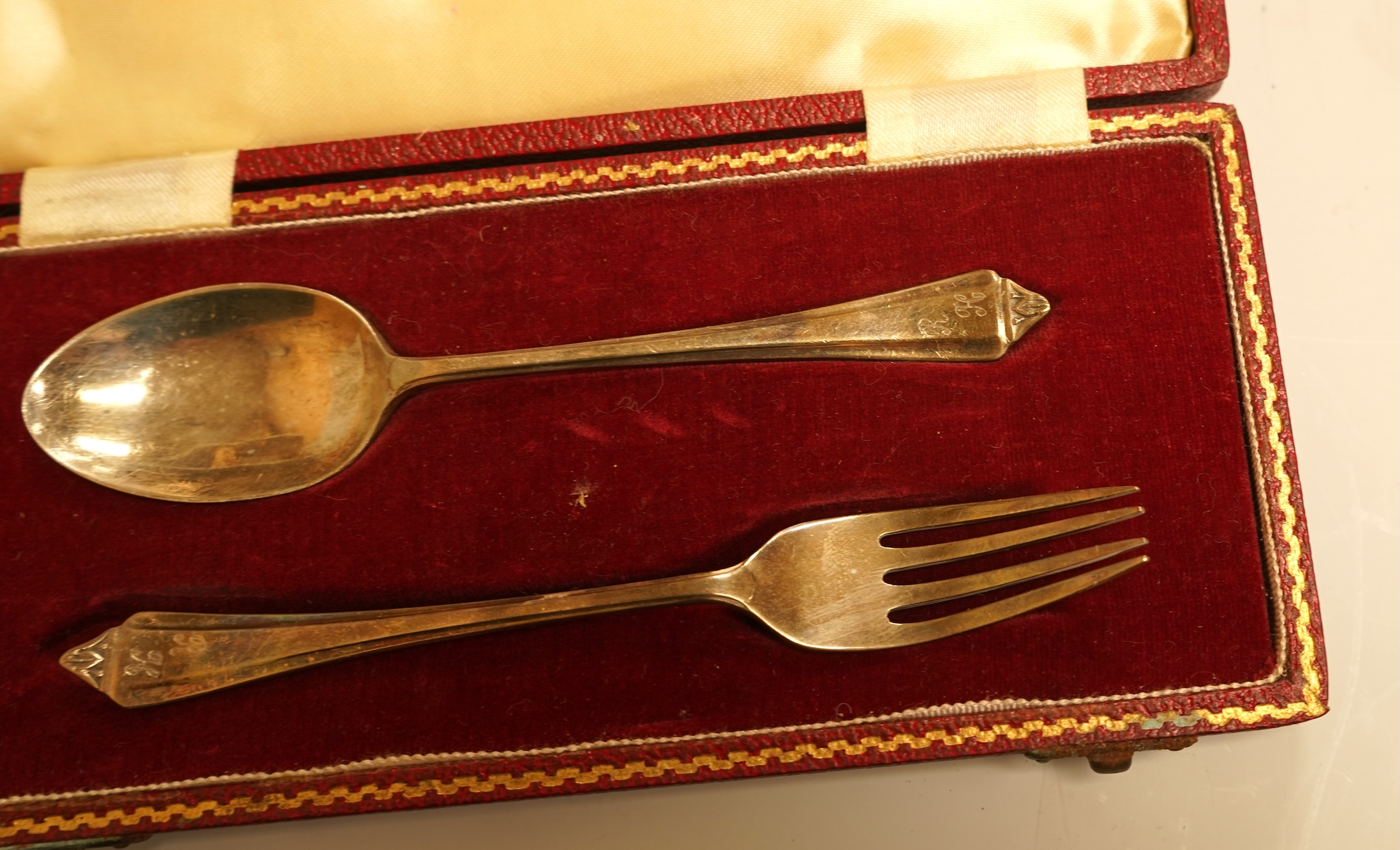 A cased set of six late Victorian silver teaspoons and matching sugar tongs, Miller Bros. Birmingham, 1900, together with three cased silver christening pairs.
